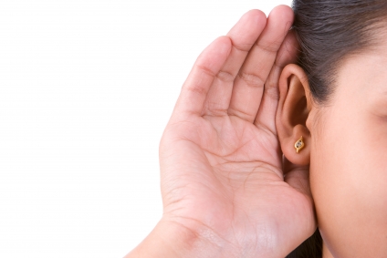 hand cupped behind ear